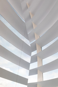 Abstract photo of concentric light sunshade rings and steel vertical mullion of Apple Store Marina Bay Sands designed by Foster and Partners.