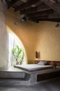 The guest bedroom of a house and studio designed by a21studio.