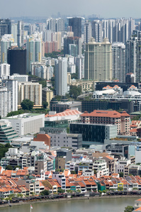 View of the low-lying shophouses juxtaposed against the high rise buildings in Singapore.