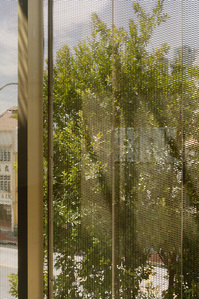 Detail shot of the golden curtain wall of an office building in Hongkong Street designed by Formwerkz Architects.