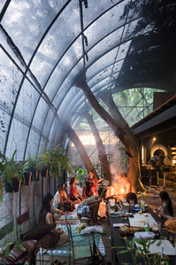 A summer ritual with fire and smokes being held inside Siu Siu Lab of Primitive Senses in Taipei, designed by Divooe Zein Architects.