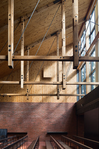 Small section timber and red brick wall of Chapel of the Techincal College in Otaniemi designed by Heikki and Kaija Siren.