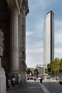 The slim profile of Pirelli Tower designed by Gio Ponti and Pier Luigi Nervi juxtaposed with the thick classical column of the station.