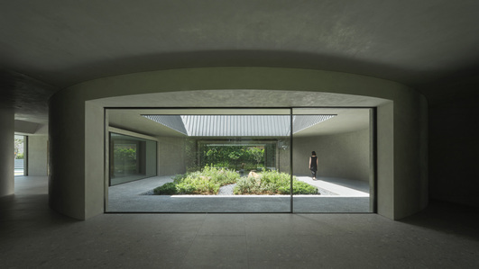 View of the courtyard of a house designed by Neri & Hu, from the interior.