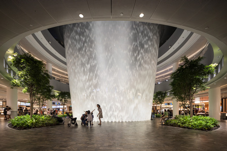 View of the basement level portion of the Rain Vortex at Jewel Changi Airport with lighting designed by Lighting Planners Associates.