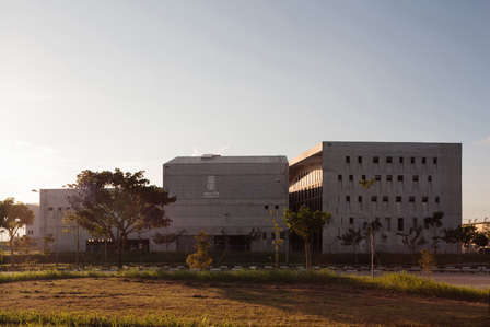 The exterior of Wahson Aerospace Facility designed by ipli architects, taken at sunset.