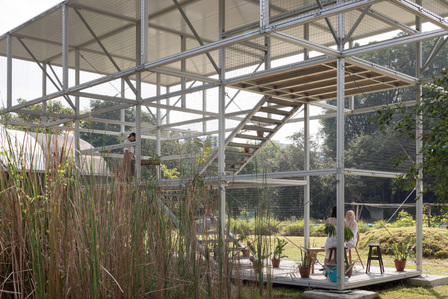Two girls chatting leisurely inside the pavilion for Archifest 2020 at Gound-Up-Initiative designed by Spatial Anatomy.