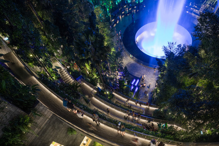 Top-down view of the Rain Vortex at Jewel Changi Airport with lighting designed by Lighting Planners Associates.