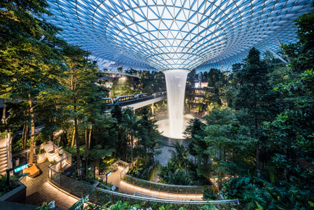 Evening view of the Rain Vortex at Jewel Changi Airport with lighting designed by Lighting Planners Associates.