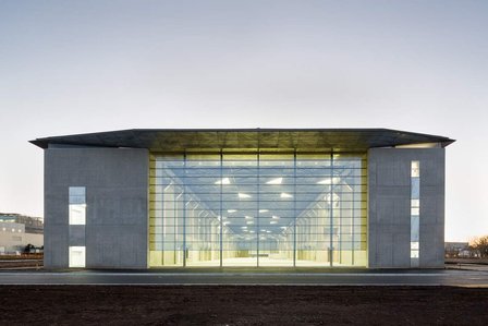 Evening view of the exterior facade of the Research and Testing Complex of Kashiwanoha Campus in Chiba, Japan. It is designed by Imai Laboratory from Tokyo University.
