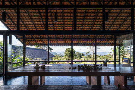 View towards the plantation from the dining hall of Sukasantai Farmstay in Indonesia designed by Goy Architects.