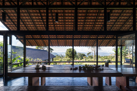 View towards the plantation from the dining hall of Sukasantai Farmstay in Indonesia designed by Goy Architects.