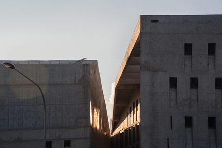 The courtyard opening of Wahson Aerospace Facility designed by ipli architects, taken at sunset.