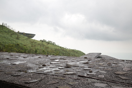 View on top of the roof of the Cherry Orchard Cemetry Corridor in Yilan, Taiwan, designed by Fieldoffice Architects, looking towards Chiang Wei-Shui Memorial Cemetery.