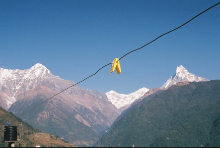 A clothes peg on the clothesline with the Annapurna mountain range in the background.