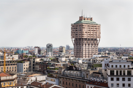 Torre Velasca, designed by BBPR, towering over the low cityscape of Milan Italy.