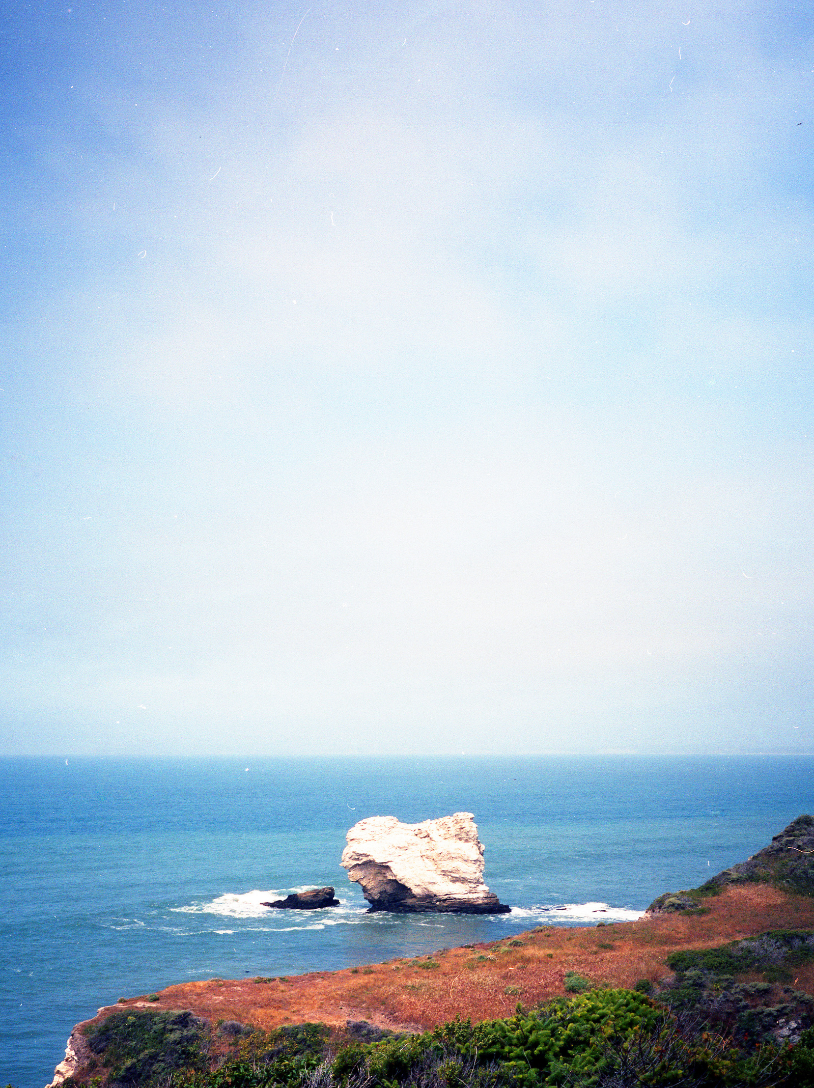 boulder off shore at Point Reyes coast. Shot on Fuji GA-645i medium format film camera