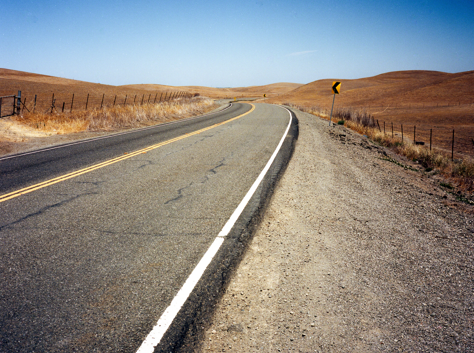 A highway through desolate hills cape. Shot on Fuji GA-645i medium format film camera