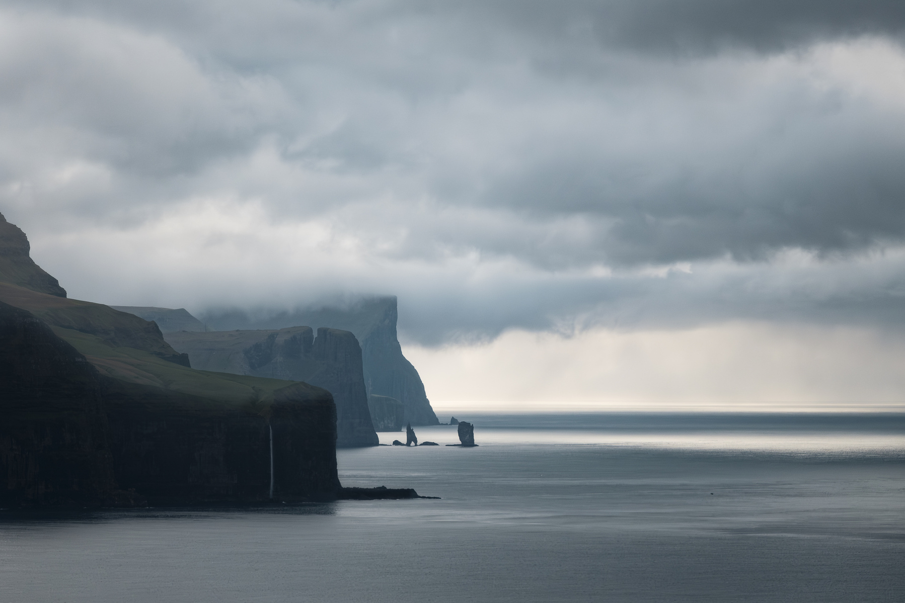 A view of distant cliffs from the Kallur Lighthouse on Kalsoy Island, Faroe Islands