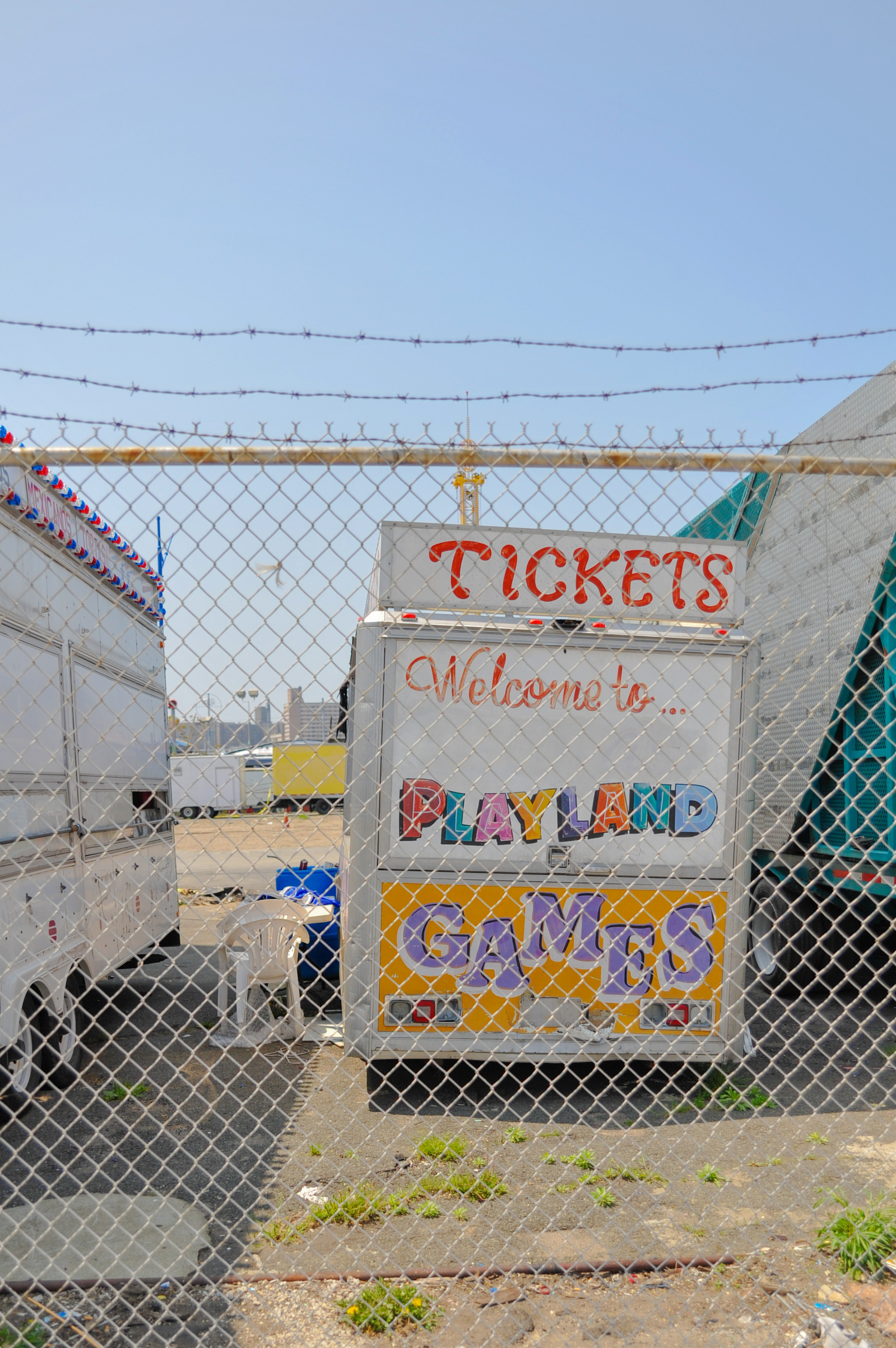 Fun fair truck behind a fence in Coney Island, New York.