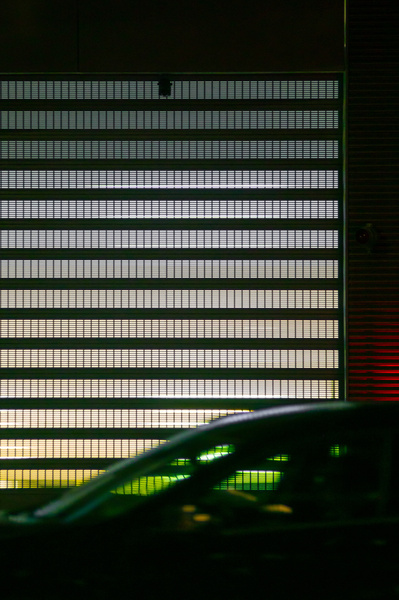 Cinematic night scene with a car passing.