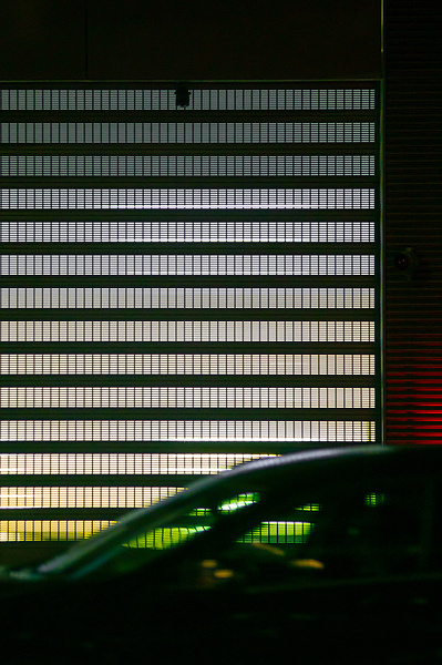 Cinematic night scene with a car passing.