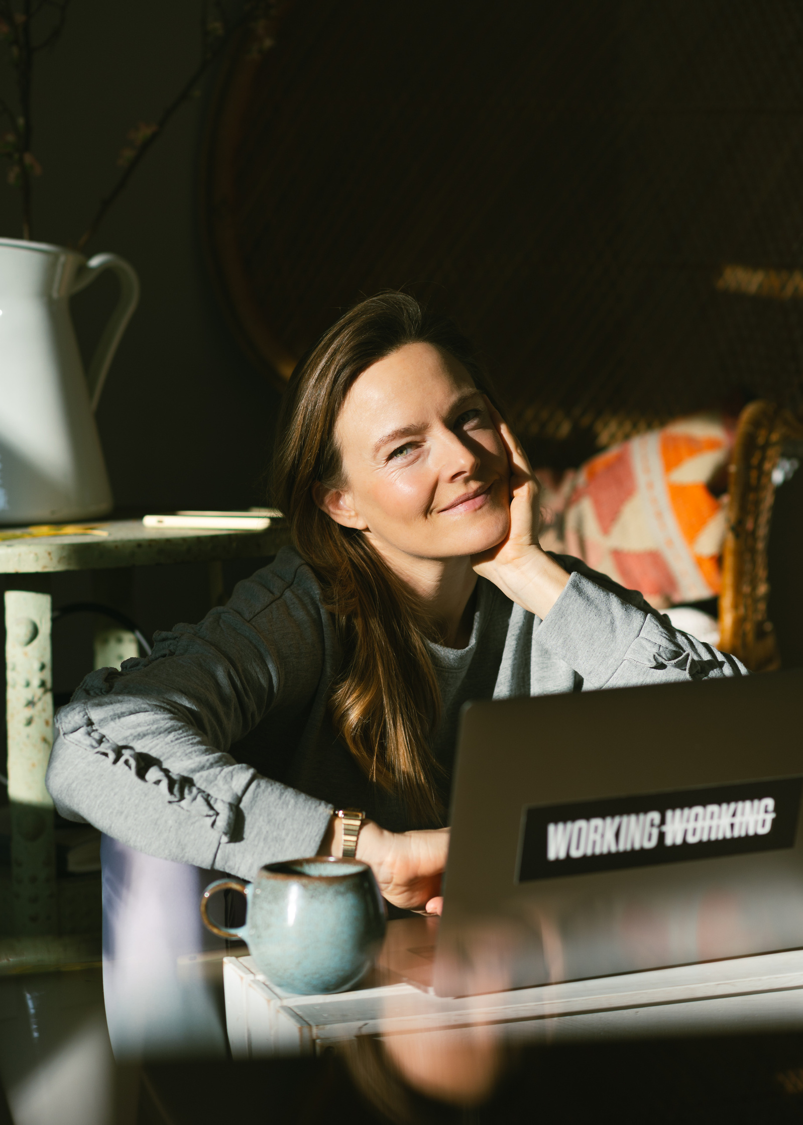 Portrait of a beautiful woman sitting in front of a laptop. 