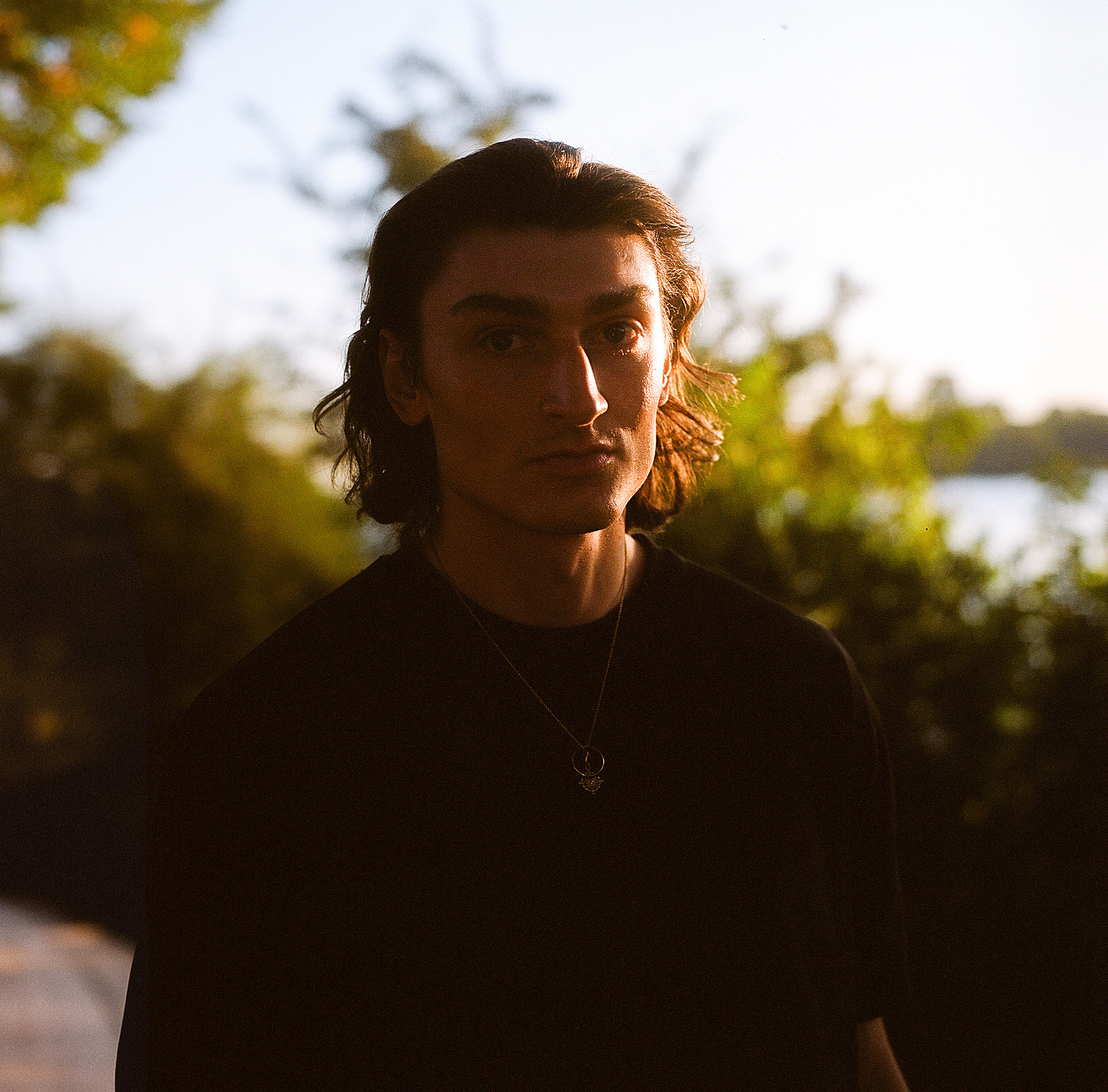 Moody portrait of a young handsome man. Shot on Hasselblad 500CM, Portra 400.
