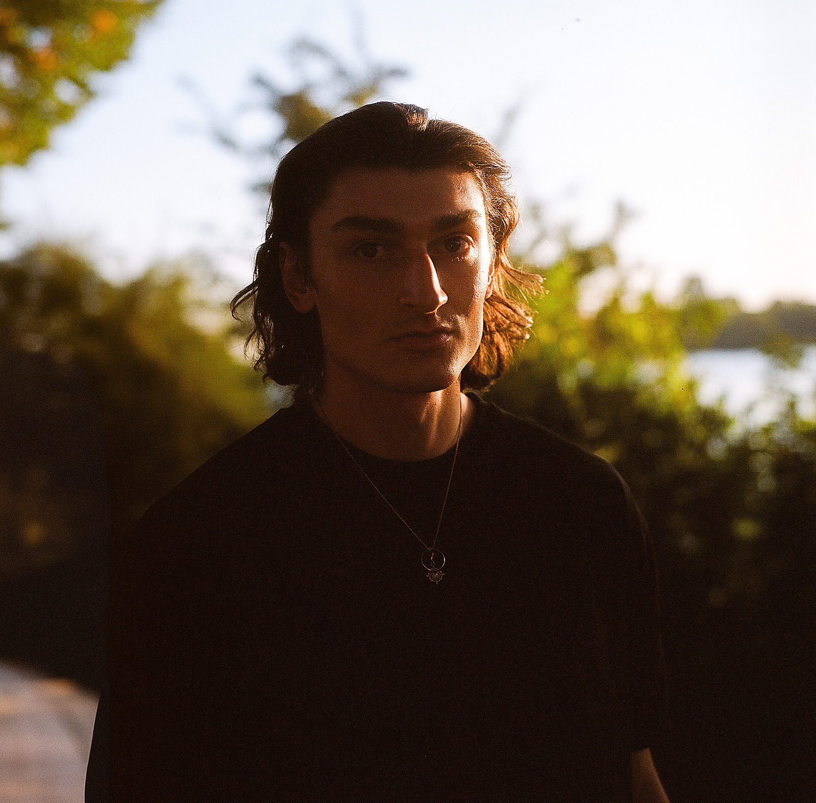 Moody portrait of a young handsome man. Shot on Hasselblad 500CM, Portra 400.