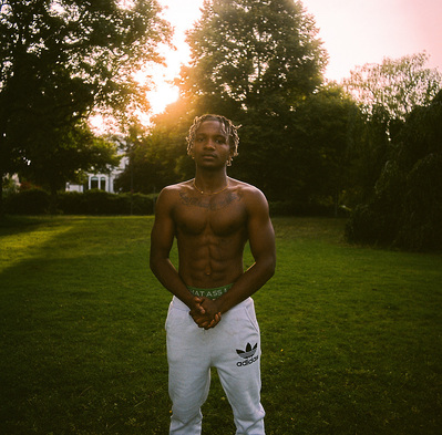 Black backlit athlete in the park. Shot on analog medium format Hasselblad 500CM, Portra 400.