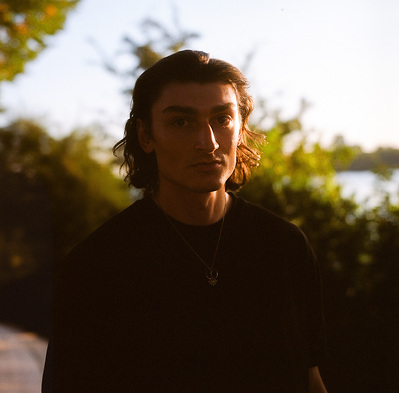 Moody portrait of a young handsome man. Shot on Hasselblad 500CM, Portra 400.