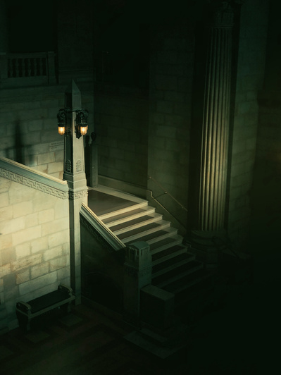 Dark and moody stairway with a lantern post leading to a lobby of an old bulding. Shot on iPhone.