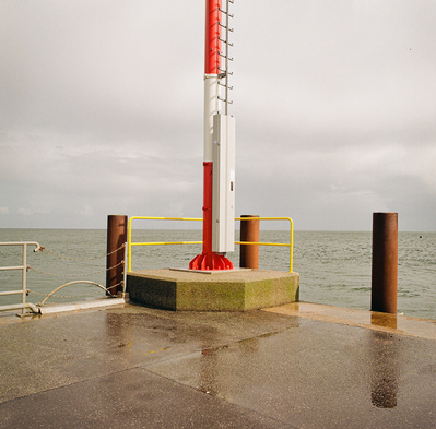 An empty boardwalk of a port on the island of Sylt. Shot on Hasselblad 500CM, Kodak Gold 200.