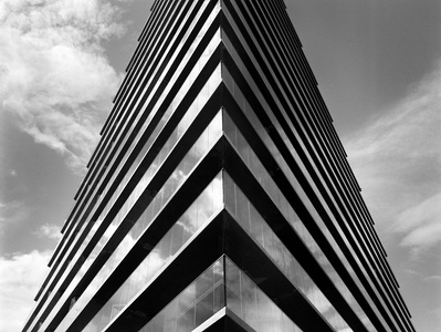Impressive photo of a building in Aarhus, Denmark reflecting clouds in the sky. Shot on Hasselblad 500CM, Kodak Tri-X 400.