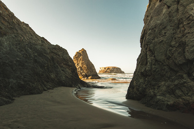 Rock formation by the sea with clear sky.