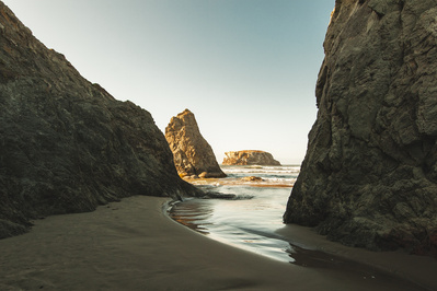 Rock formation by the sea with clear sky.