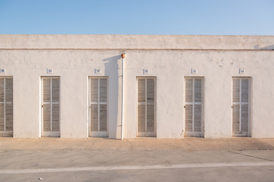 Abstract white building with warm light.