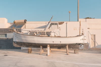 A fisher boat in the drydock for maintenance at sunset on Mallorca, Spain.
