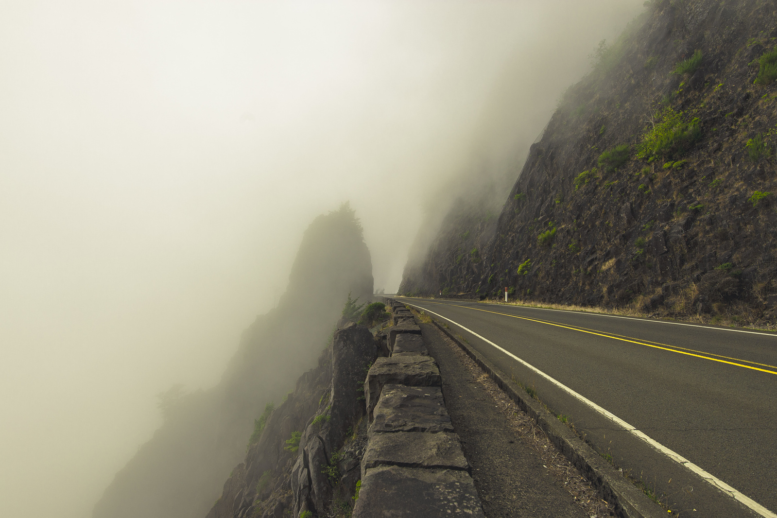 Foggy highway next to the abyss in the Pacific North West.