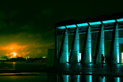 Dark and cinematic scene of a building at the port of Antwerp, Belgium.