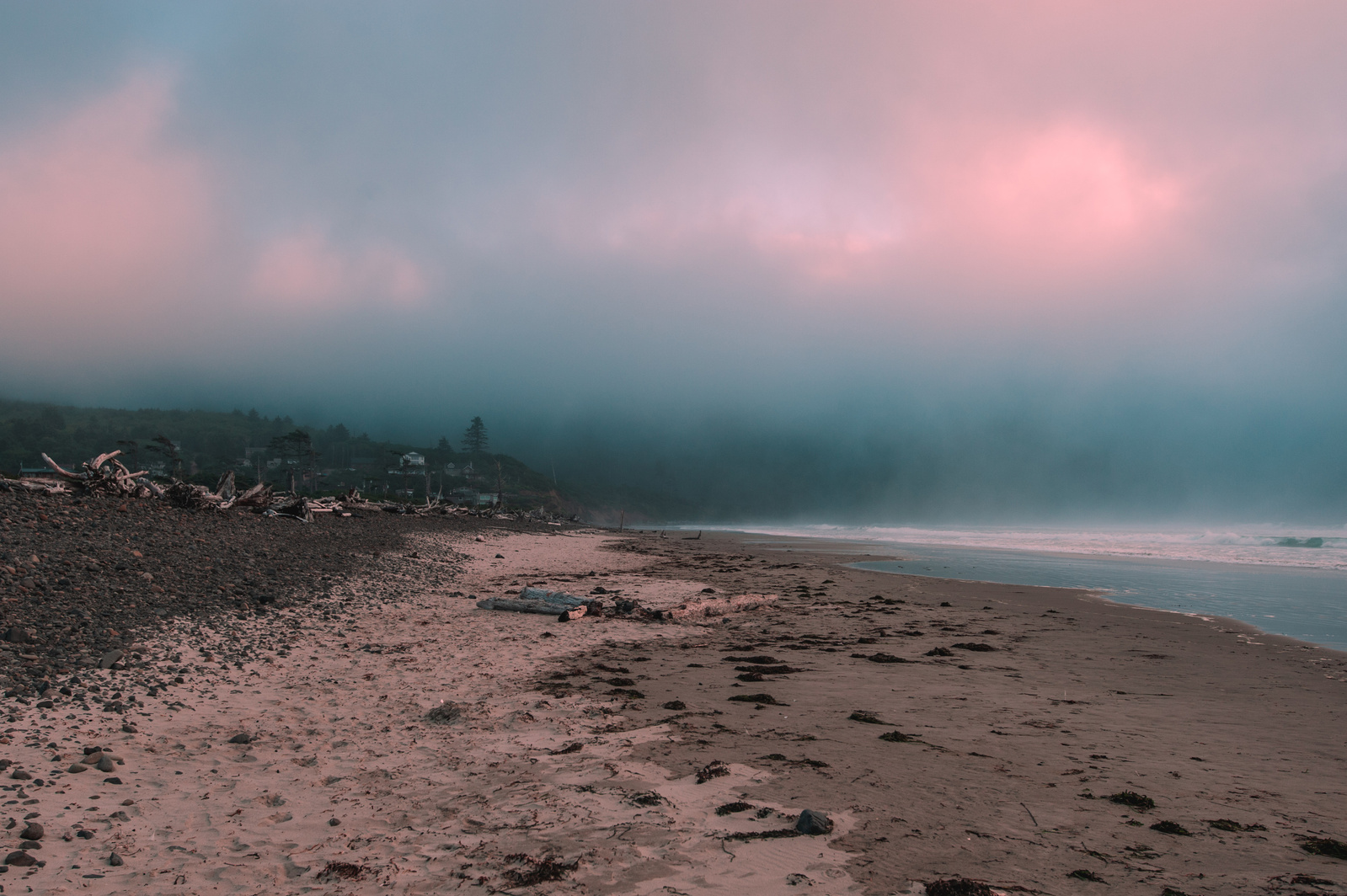 Gloomy cinematic scene of thick clouds by the beach in Tillamook, Oregon. 