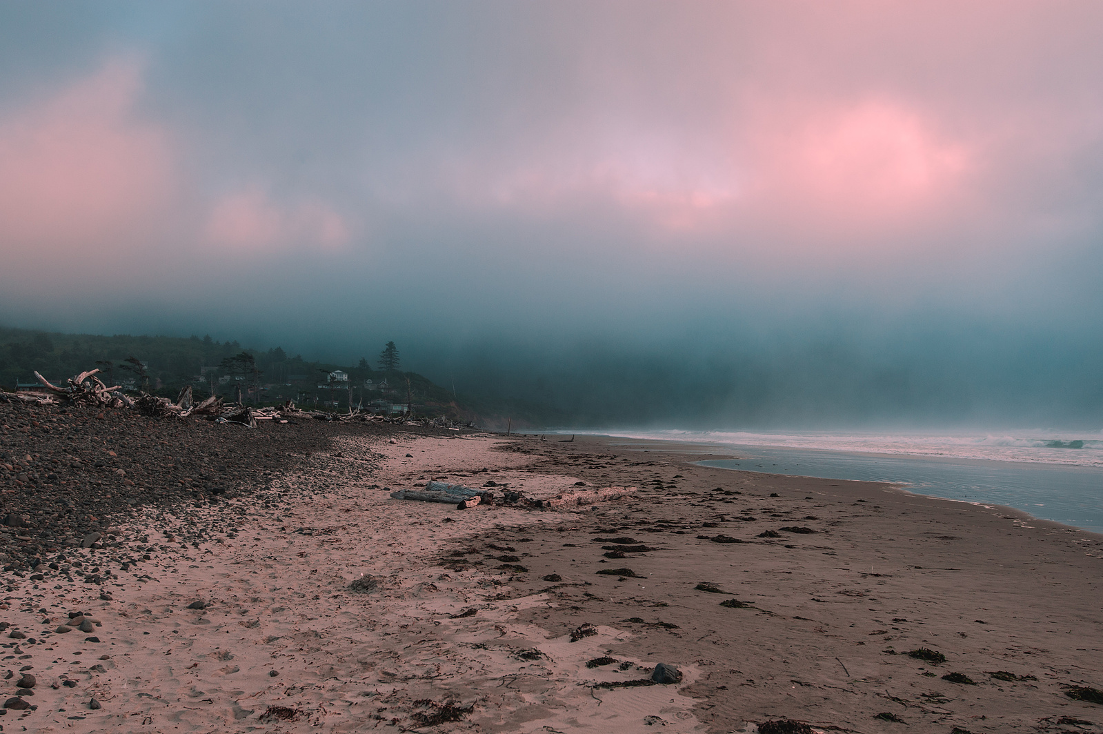 Gloomy cinematic scene of thick clouds by the beach in Tillamook, Oregon. 