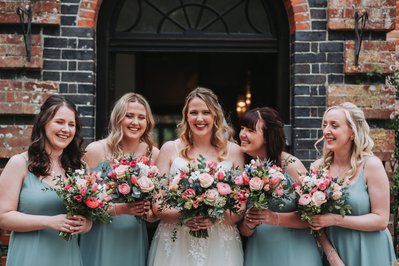 Bride and her bridal party with modern, stylish wedding hair and makeup 
