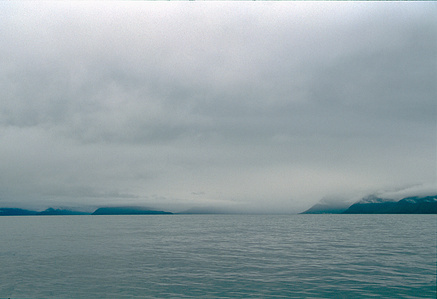 Mountainous fjords- seascape with grey dramatic sky