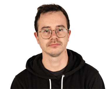 Young man with brown hair and glasses in a black hooded sweatshirt