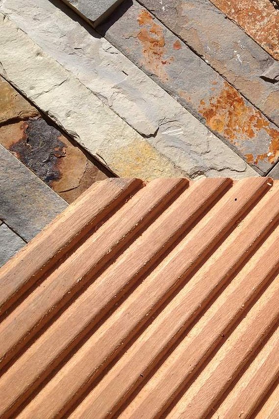 Garden landscaping using graphite granite calibrated slabs, hardwood decking in Devon. Design and build by Seriously Good Landscapes