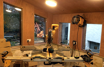 work in progress of build on Man cave style garden room in Lustleigh Devon, Douglas fir waney edge board and natural roofing slates