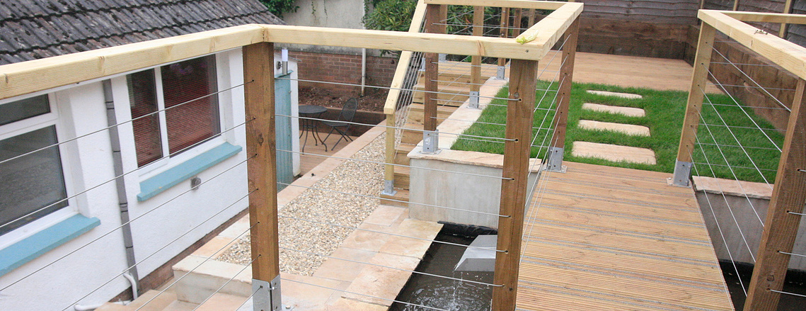 A contemporary area centered around a water feature, and using cantilever bridges. Design and build by Sam Bairstow of Seriously Good Landscapes