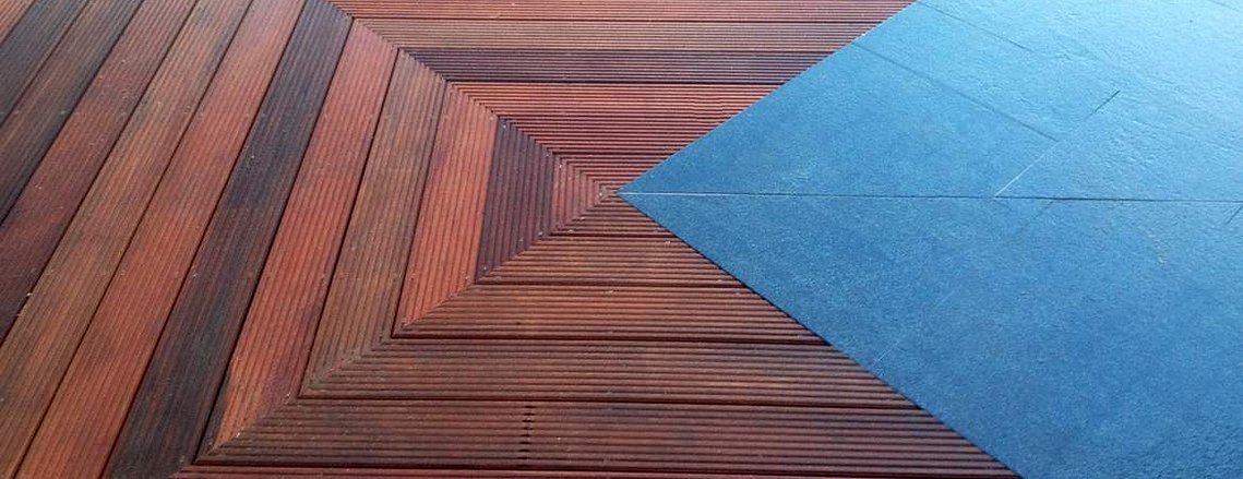 Garden landscaping using graphite granite calibrated slabs, hardwood decking in Devon. Design and build by Seriously Good Landscapes