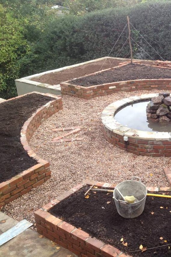 Garden ladscapiong in Chagford Devon, using a compass design to incorporate planting and water feature